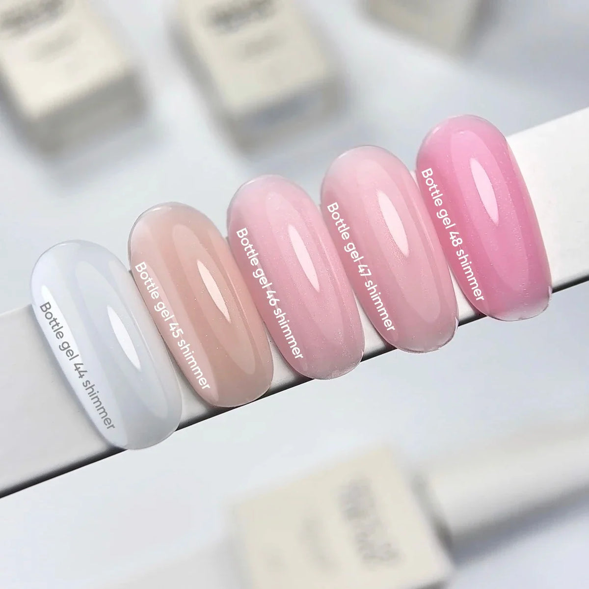NAILSOFTHEDAY Bottle Gel 46 Shimmer — gel ultrarresistente rosa lechoso con shimmer plateado para reforzar las uñas, 10 ml