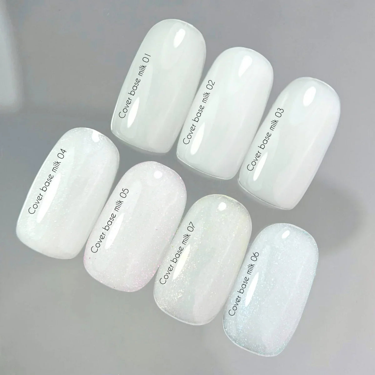Nailsoftheday Cover base NEW Formula milk 07 — un tono lechoso, semitransparente con brillo dorado que aporta un reflejo cálido dorado, una base de camuflaje para uñas, 10 ml.